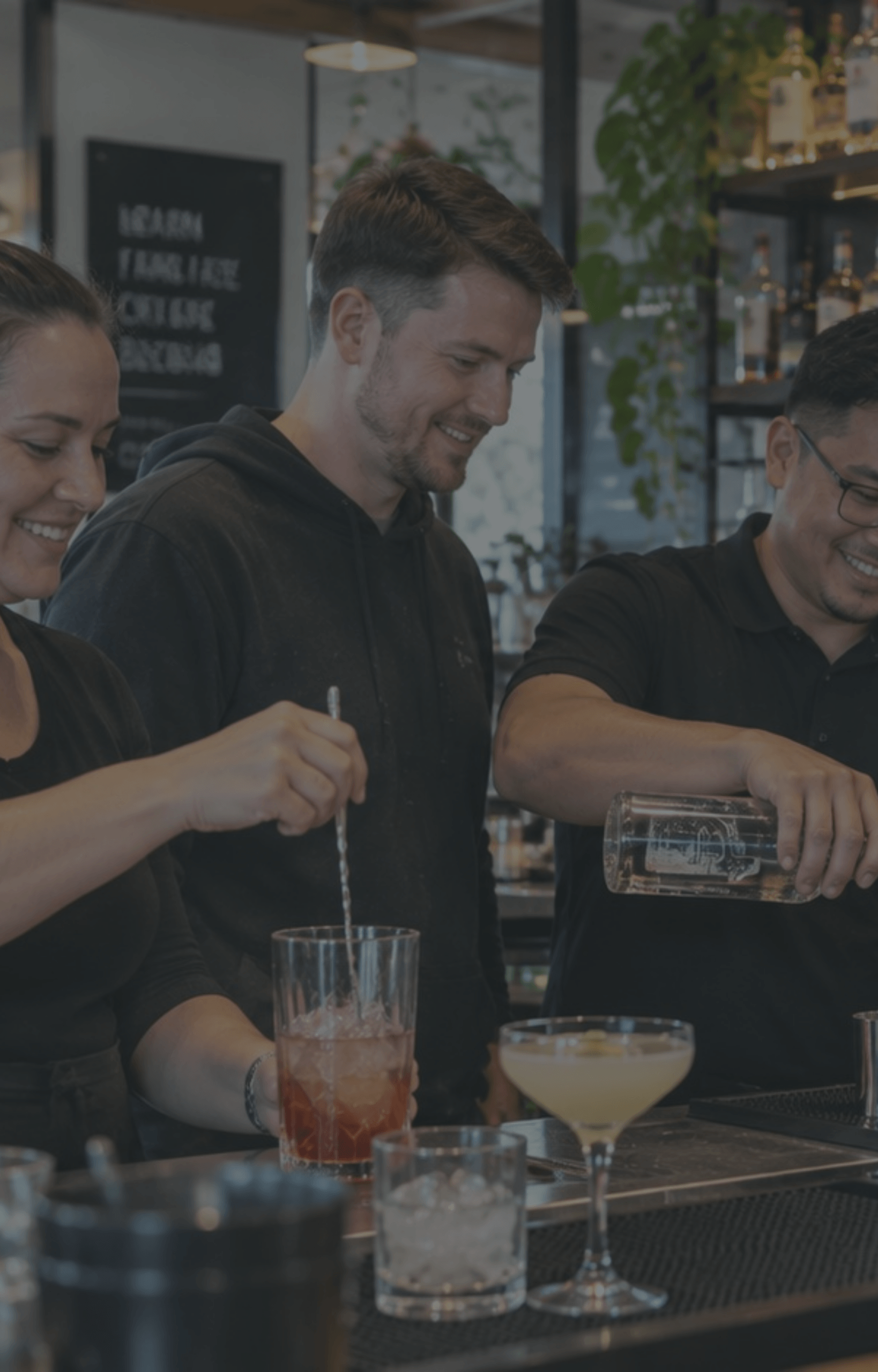 diverse-hospitality-trainees-cocktail-making-bar-dark-overlay-nz
